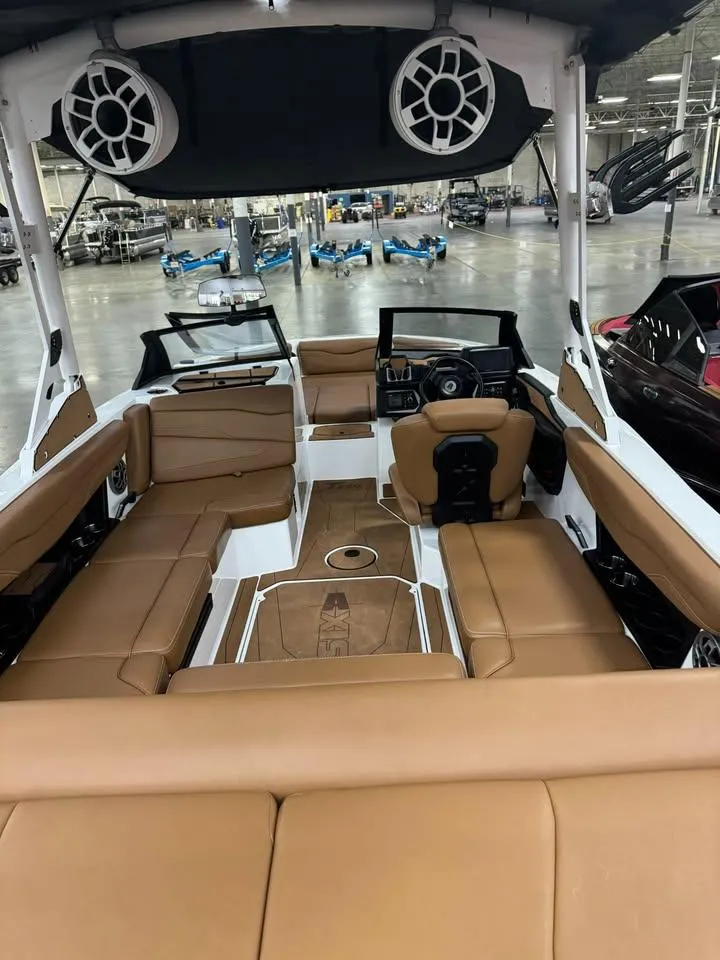 Slide: The Image of 2023 Axis T220 boat interior with tan leather seating and modern design. - 3