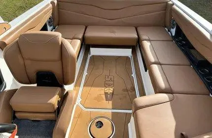 Slide: The Image of 2023 Axis T220 boat interior with tan leather seating and sleek design. - 5