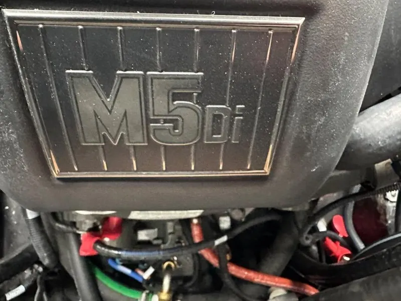 Slide: The Image of Close-up of Axis T220 engine component with M5Di label, 2023 model. - 6