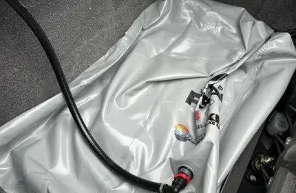 Slide: The Image of Axis T220 2023 boat ballast bag with hose connection in storage compartment. - 8