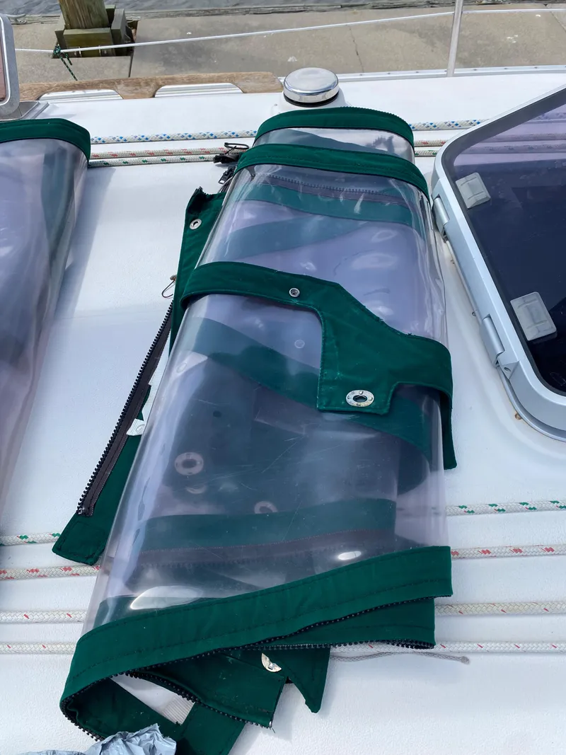 Slide: The Image of Green sail cover on 1986 Nonsuch 30 Ultra deck. - 20