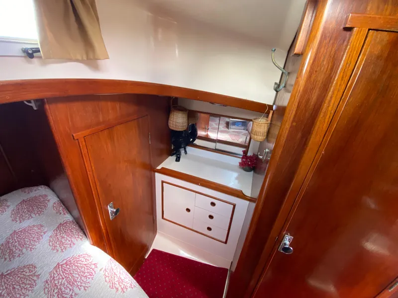 Slide: The Image of 1986 Nonsuch 30 Ultra cabin interior with wood finish and cozy decor. - 21