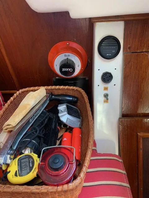 Slide: The Image of Basket of tools and gauges inside a 1986 Nonsuch 30 Ultra sailboat. - 27
