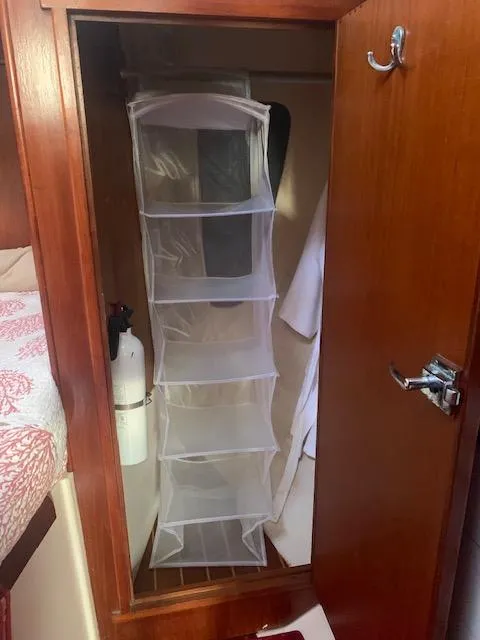 Slide: The Image of Hanging organizer in 1986 Nonsuch 30 Ultra sailboat closet. - 43
