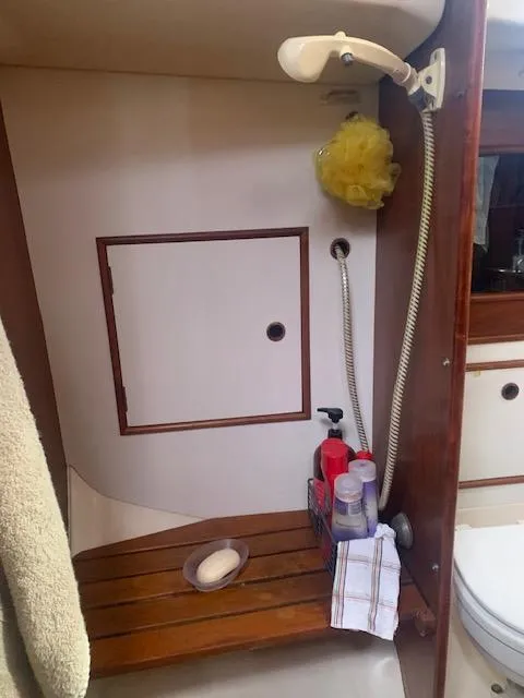 Slide: The Image of 1986 Nonsuch 30 Ultra yacht bathroom with shower and toiletries. - 44