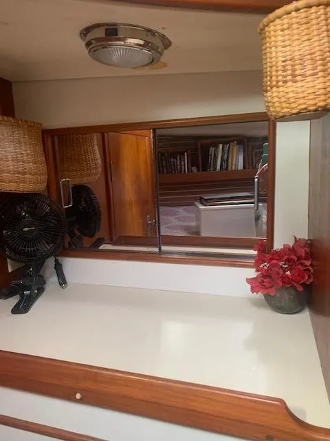 Slide: The Image of Interior of 1986 Nonsuch 30 Ultra sailboat with wood accents and decor. - 45