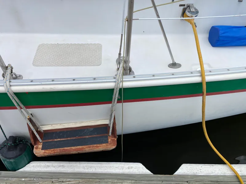 Slide: The Image of Nonsuch 30 Ultra 1986 sailboat with dock ladder and hose connection. - 5