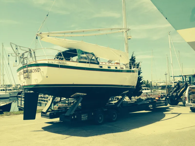 Slide: The Image of 1986 Nonsuch 30 Ultra sailboat on trailer at marina, ready for transport. - 6