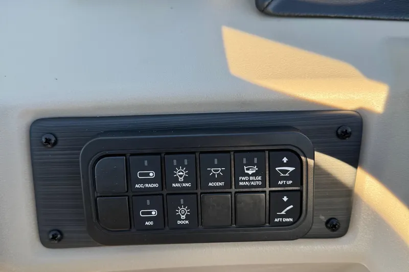 Slide: The Image of Control panel of 2025 Bennington 23 SSB boat with various function buttons. - 13