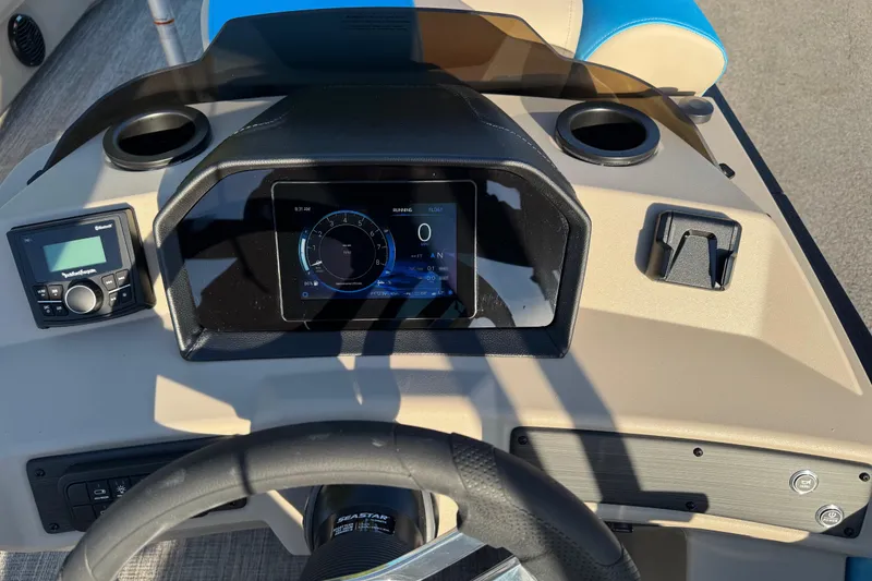 Slide: The Image of Dashboard of 2025 Bennington 23 SSB boat with digital display and controls. - 14