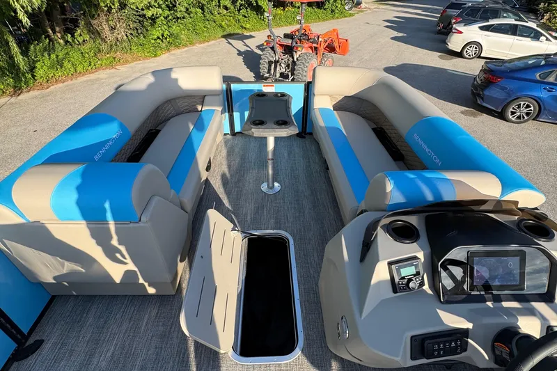 Slide: The Image of 2025 Bennington 23 SSB pontoon boat interior with seating and control panel. - 16