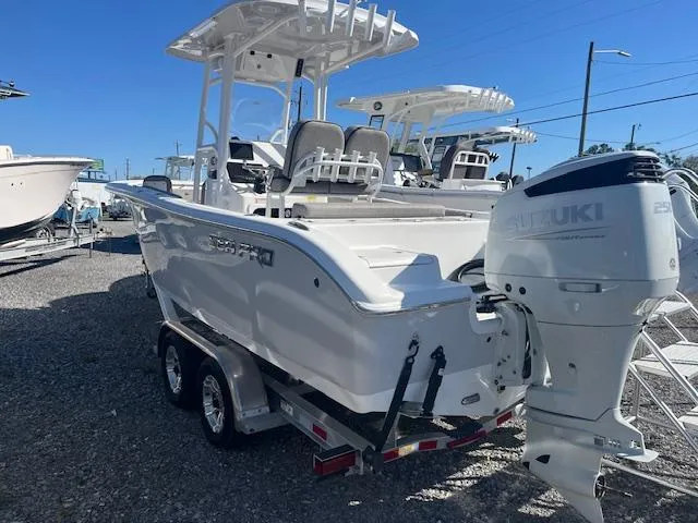 Slide: The Image of 2023 Sea Pro 219CC boat with Suzuki outboard motor on a trailer. - 11