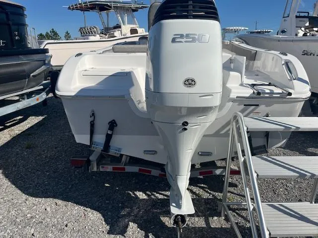 Slide: The Image of 2023 Sea Pro 219CC boat with a 250 horsepower outboard motor, parked on a trailer. - 3
