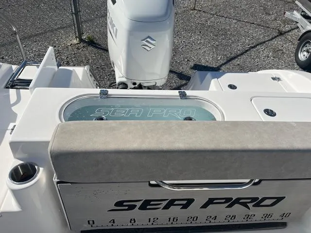 Slide: The Image of 2023 Sea Pro 219CC boat with Suzuki engine, featuring a livewell and measuring scale. - 5
