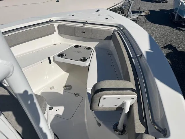 Slide: The Image of 2023 Sea Pro 219CC boat interior with seating and cup holders. - 9