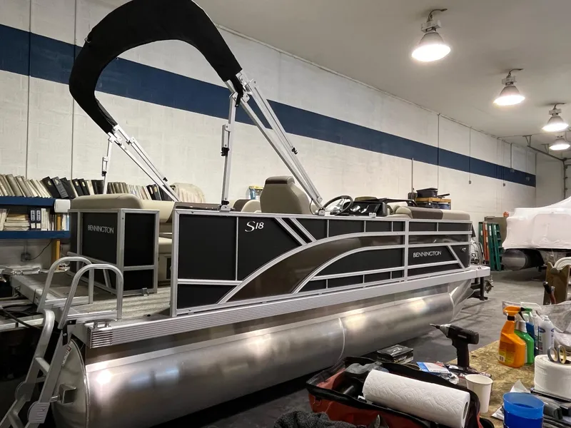 Slide: The Image of 2025 Bennington 188 SL pontoon boat in a workshop setting. - 6