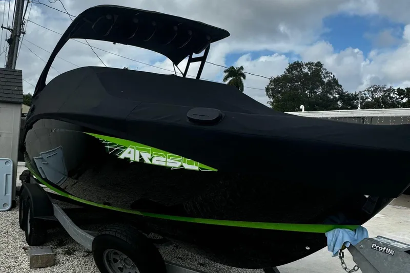 Slide: The Image of 2021 Yamaha AR250 boat covered, on trailer, outdoors. - 11