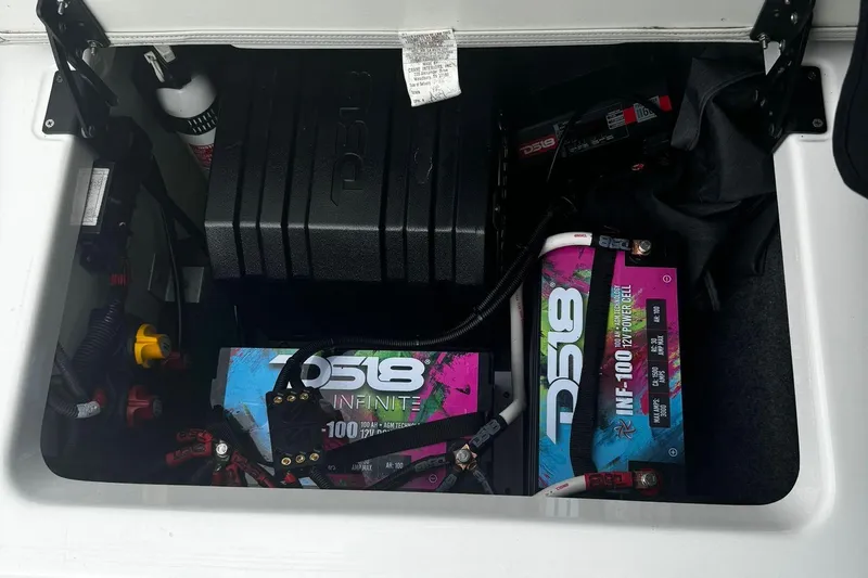 Slide: The Image of Yamaha AR250 2021 boat battery compartment with DS18 batteries and accessories. - 7