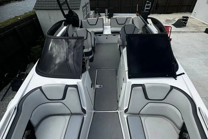Slide: The Image of 2021 Yamaha Boats AR250 interior with sleek seating and modern design. - 8