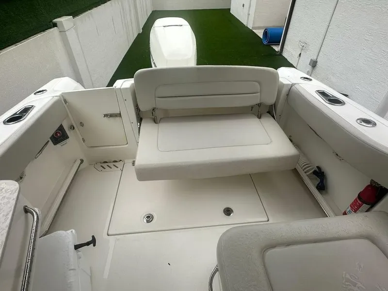 Slide: The Image of 2020 Boston Whaler 230 Vantage boat interior with seating and storage. - 13