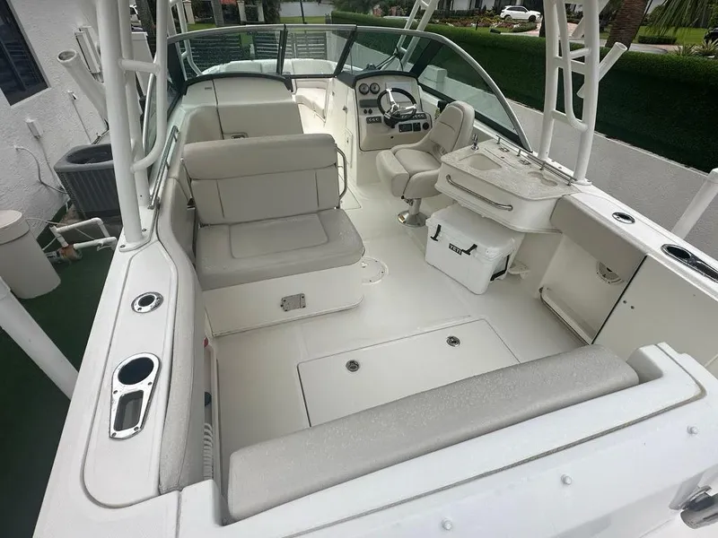 Slide: The Image of 2020 Boston Whaler 230 Vantage boat interior with seating and helm. - 15