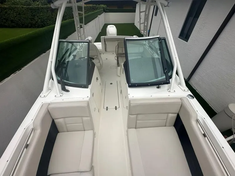 Slide: The Image of 2020 Boston Whaler 230 Vantage boat interior with dual consoles and seating. - 17