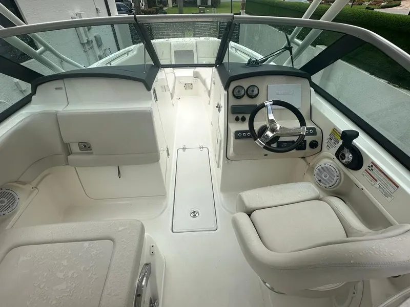 Slide: The Image of 2020 Boston Whaler 230 Vantage boat interior with steering wheel and seating. - 9