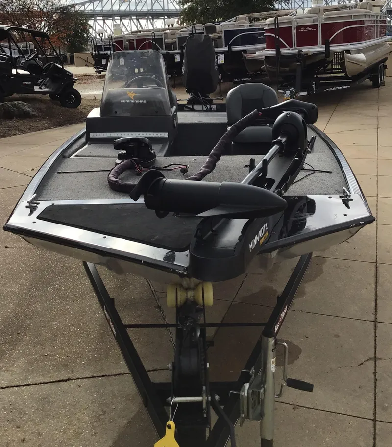 Slide: The Image of 2020 Tracker BASS TRK CL XL boat, front view, parked outdoors. - 5