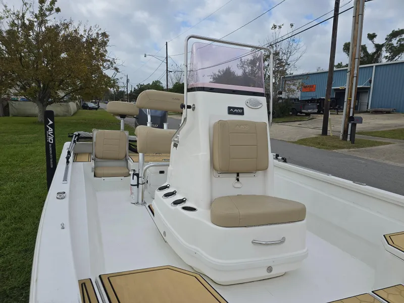 Slide: The Image of 2022 Avid 21 Mag boat with beige seating and center console. - 23