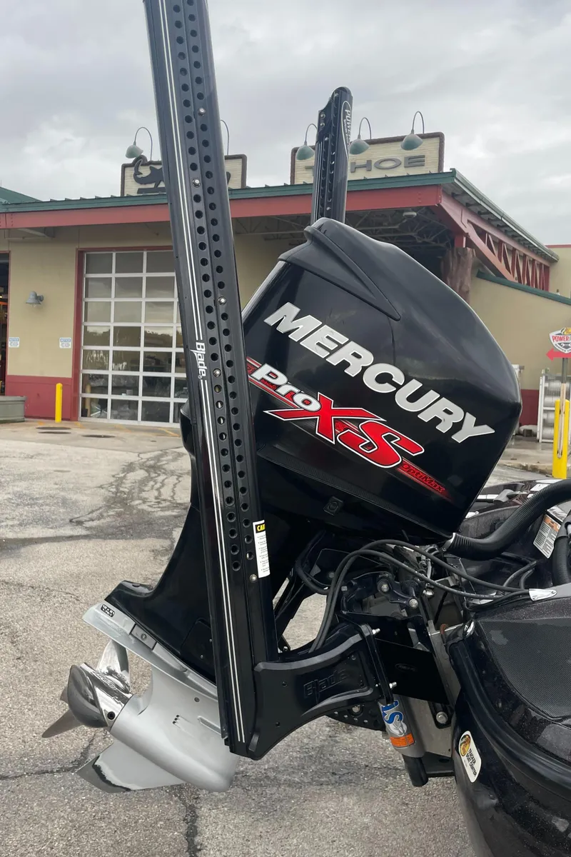Slide: The Image of 2016 Nitro Z21 XL Pro with Mercury Pro XS engine in a parking lot. - 10
