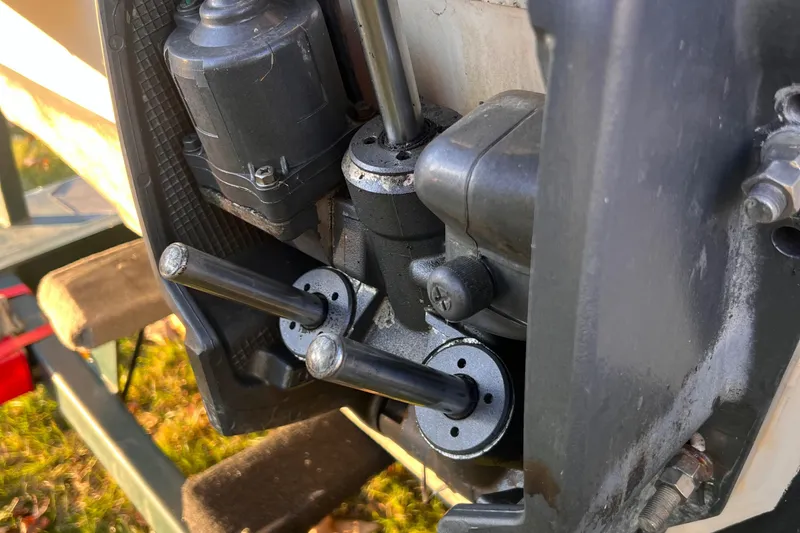 Slide: The Image of Close-up of a 2001 Grady-White Sportsman 180 boat engine components. - 14