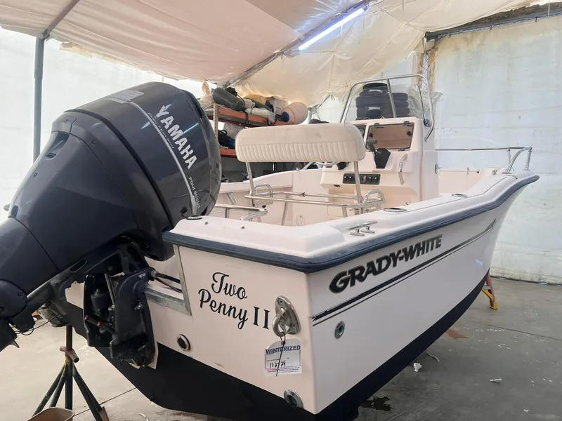 Slide: The Image of 2001 Grady-White Sportsman 180 boat with Yamaha outboard motor in covered storage. - 4