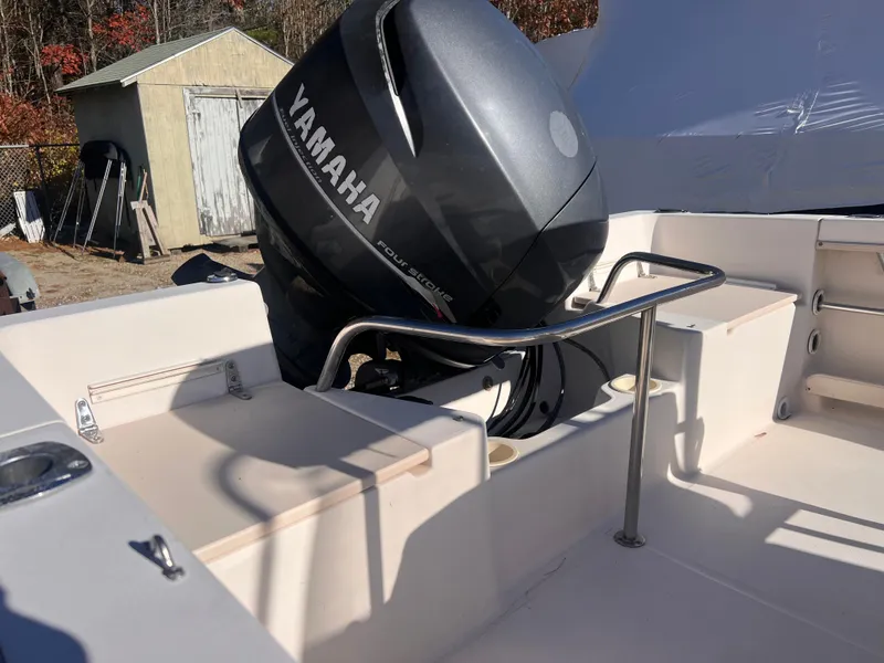 Slide: The Image of 2001 Grady-White Sportsman 180 boat with Yamaha outboard motor in a yard setting. - 9