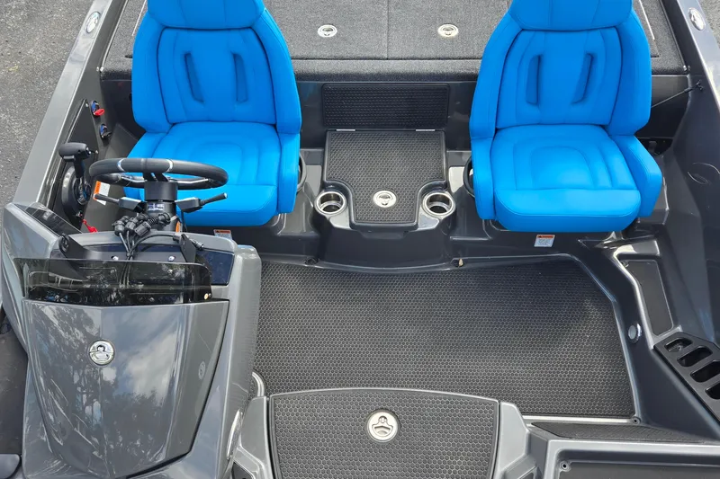 Slide: The Image of Interior of 2025 iKon LXL21 boat with blue seats and steering console. - 15