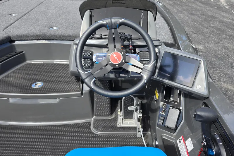 Slide: The Image of Steering wheel and dashboard of iKon LXL21 boat, 2025 model, featuring modern controls and touchscreen display. - 21