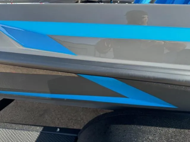 Slide: The Image of Rear view of a 2025 iKon LXL21 boat with a powerful outboard motor. - 7