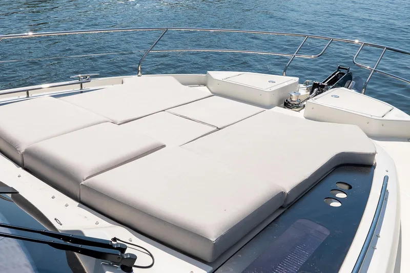 Slide: The Image of Luxurious sunbathing deck on 2026 Prestige F5.7 yacht, overlooking serene waters. - 15