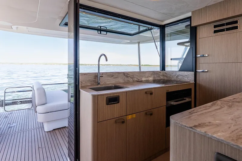 Slide: The Image of Modern kitchen on Prestige F5.7 yacht, 2026 model, with ocean view and sleek design. - 48