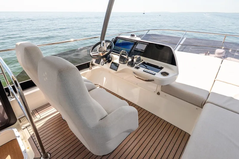 Slide: The Image of Luxurious 2026 Prestige F5.7 yacht helm with modern controls and ocean view. - 22