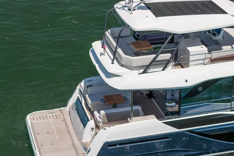 Slide: The Image of Luxury Prestige F5.7 yacht, 2026 model, featuring spacious decks and elegant design on the water. - 11