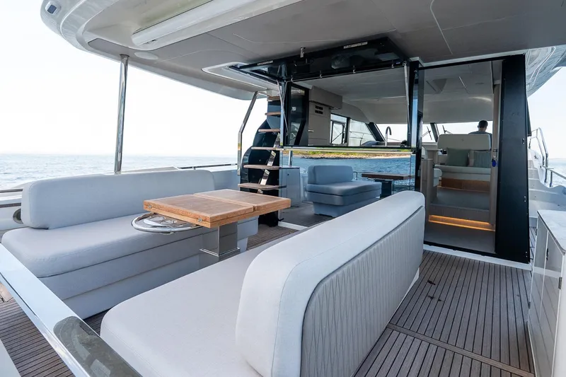 Slide: The Image of Luxurious 2026 Prestige F5.7 yacht interior with elegant seating and ocean view. - 40