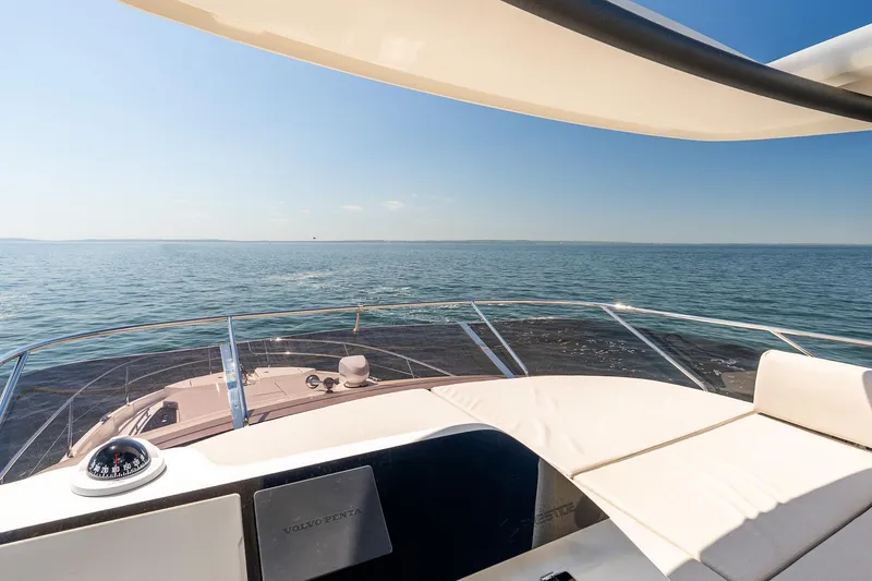 Slide: The Image of Luxury Prestige F5.7 yacht cruising on open sea, 2026 model, with clear blue skies. - 28