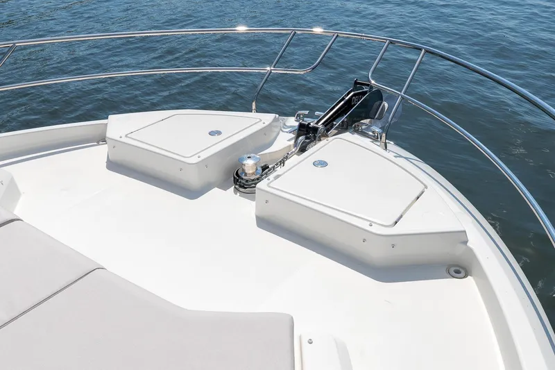 Slide: The Image of Bow of 2026 Prestige F5.7 yacht with anchor and storage compartments. - 16