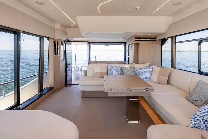 Slide: The Image of Luxurious interior of 2026 Prestige F5.7 yacht with panoramic windows and elegant seating. - 52