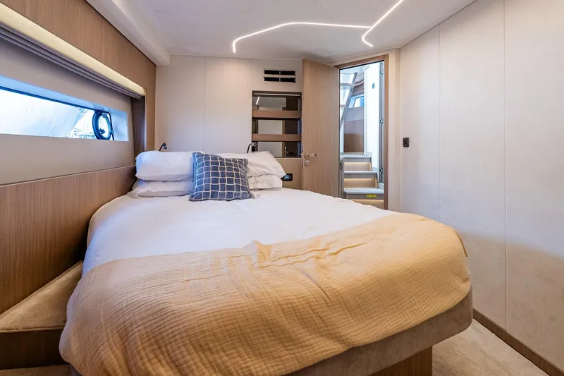 Slide: The Image of Luxurious cabin interior of 2026 Prestige F5.7 yacht with modern design and cozy bedding. - 78