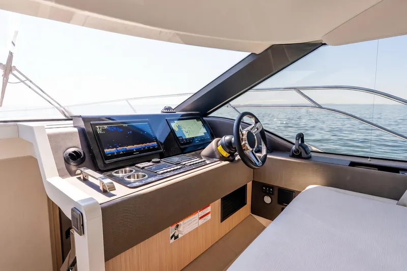 Slide: The Image of Luxurious 2026 Prestige F5.7 yacht cockpit with advanced navigation systems and ocean view. - 62