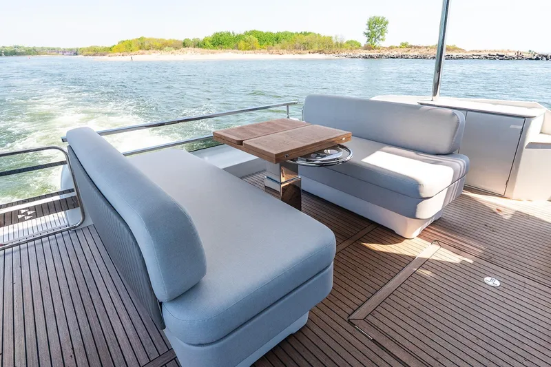 Slide: The Image of Luxurious seating area on 2026 Prestige F5.7 yacht with scenic water view. - 42