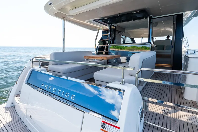 Slide: The Image of Luxurious 2026 Prestige F5.7 yacht with spacious deck and modern seating. - 45