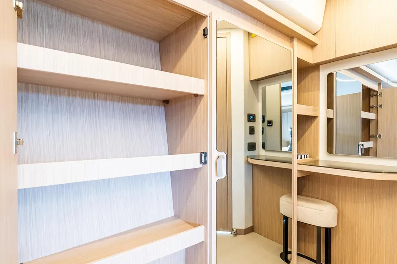 Slide: The Image of Modern interior of Prestige F5.7 yacht, featuring sleek wooden cabinetry and a stylish vanity area. - 69