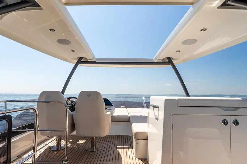 Slide: The Image of Luxurious 2026 Prestige F5.7 yacht interior with ocean view and modern seating. - 31